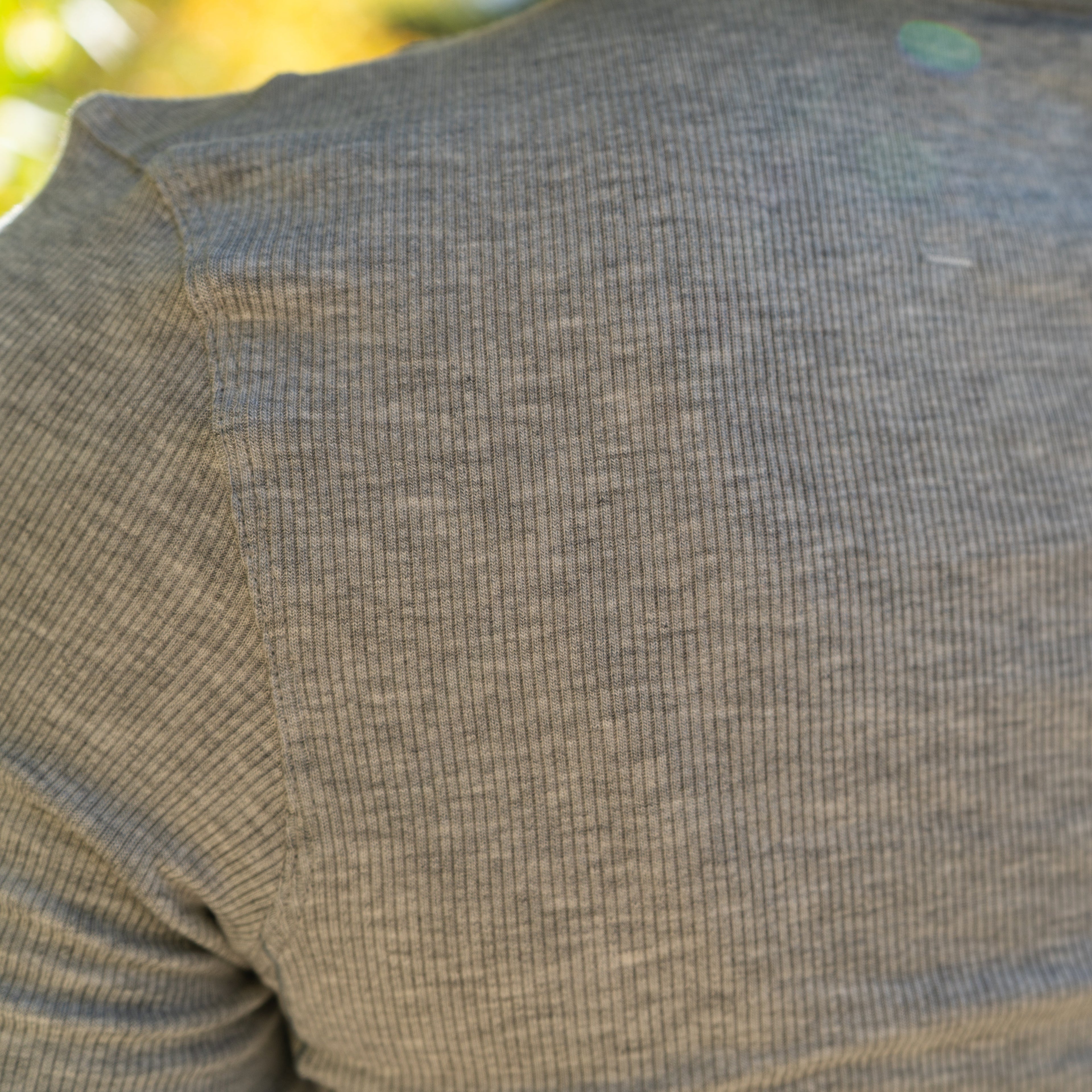 Close-up of gray ribbed modal fabric from the Stillwater Modal Tee showing fine texture and soft stretch.