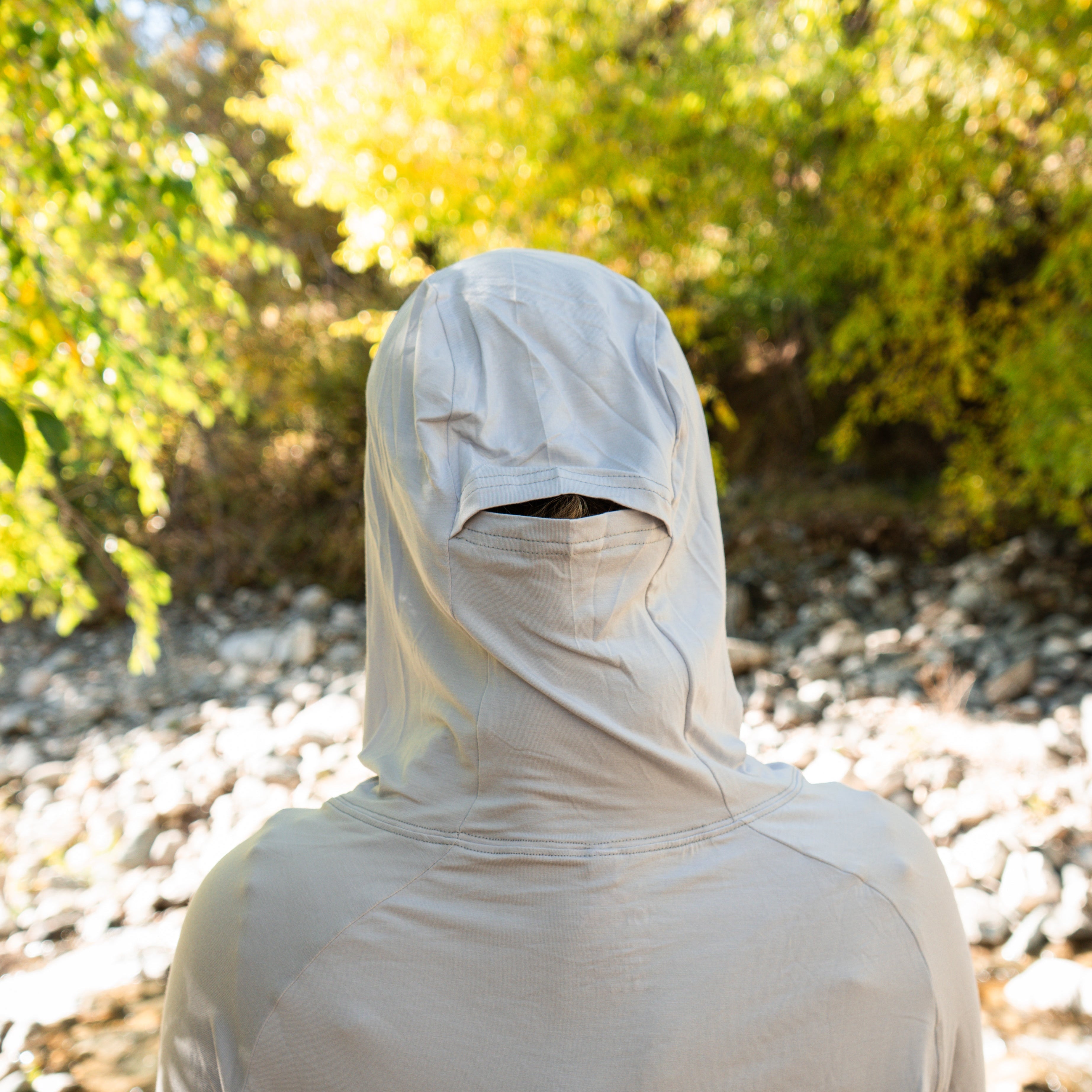 Back view of the Gray Brook Bamboo Sun Hoodie highlighting the functional ponytail slot and relaxed hood design