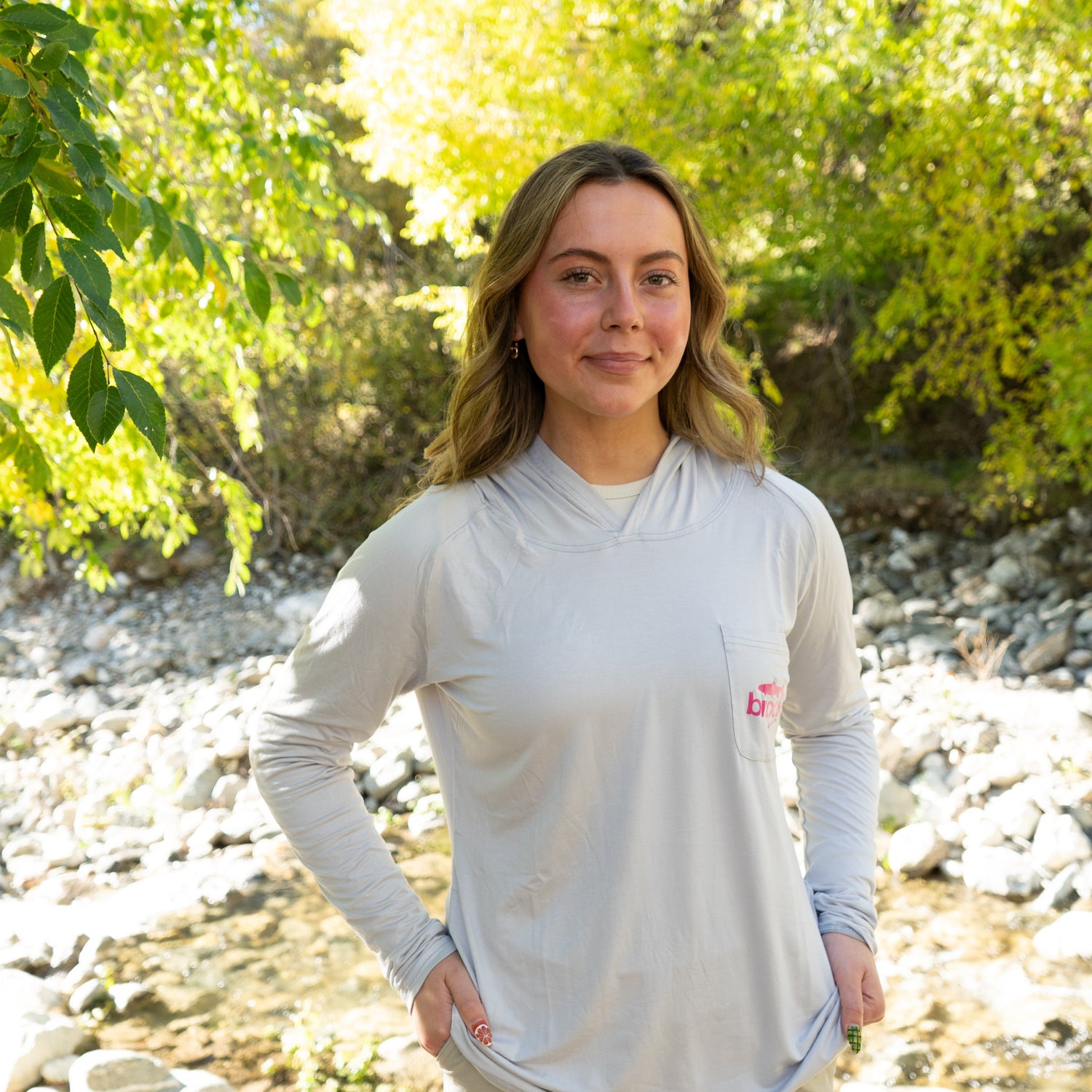 Close-up of soft bamboo fabric on women’s gray UPF 50+ sun hoodie
