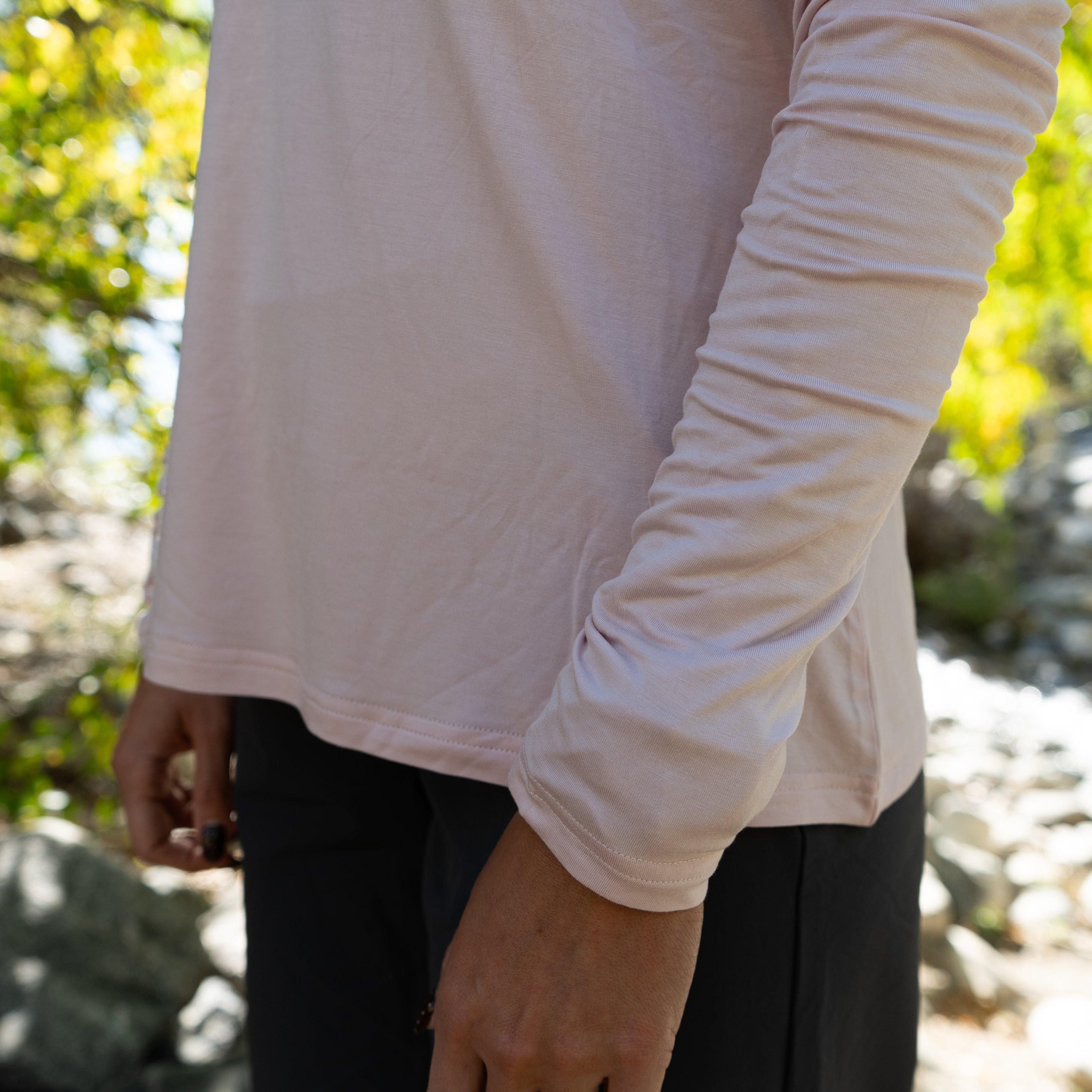 Close-up of the sleeve on the Pink Brook Bamboo Sun Hoodie showing soft bamboo fabric and quality stitching.