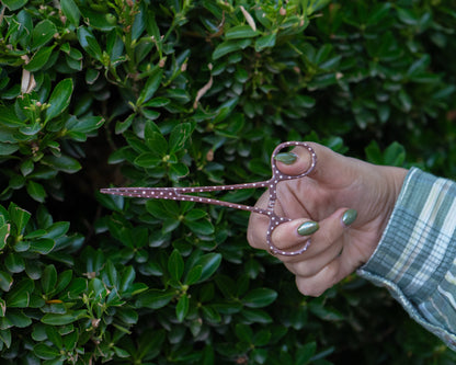 Polka dot fishing tool with fine-tip jaws and locking clamp mechanism.
