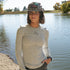 Woman wearing gray Stillwater Modal Tee with tonal logo, showing slim fit and long sleeves for fishing or layering.
